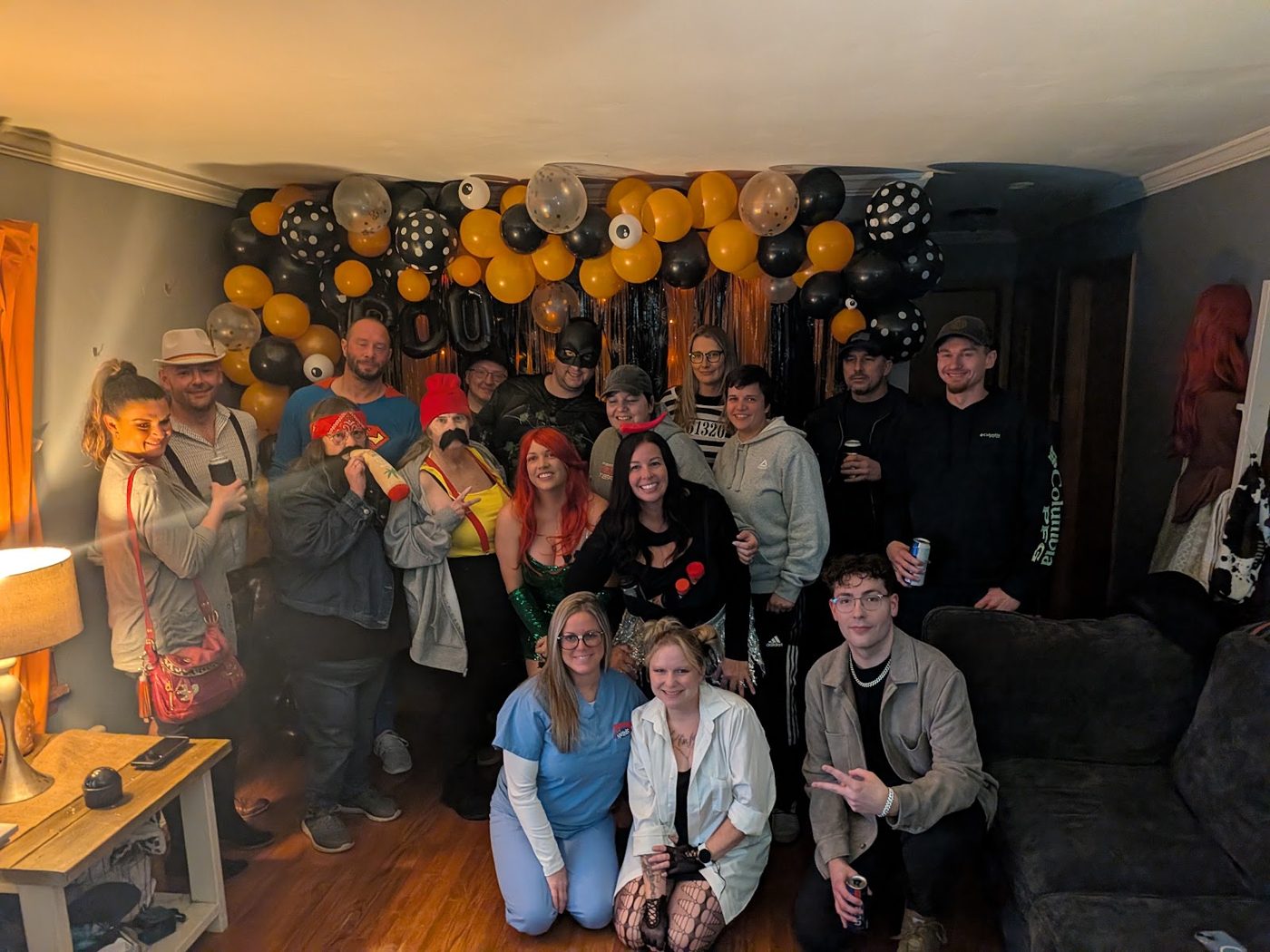 The whole crowd packed into the living room in costume